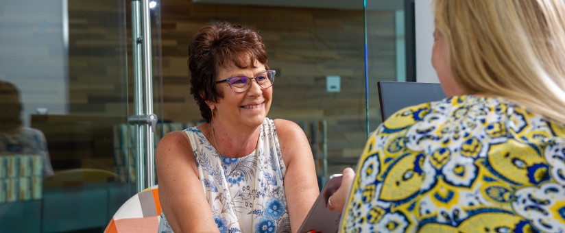 Receptionist talking to a patient Receptionist talking to a patient